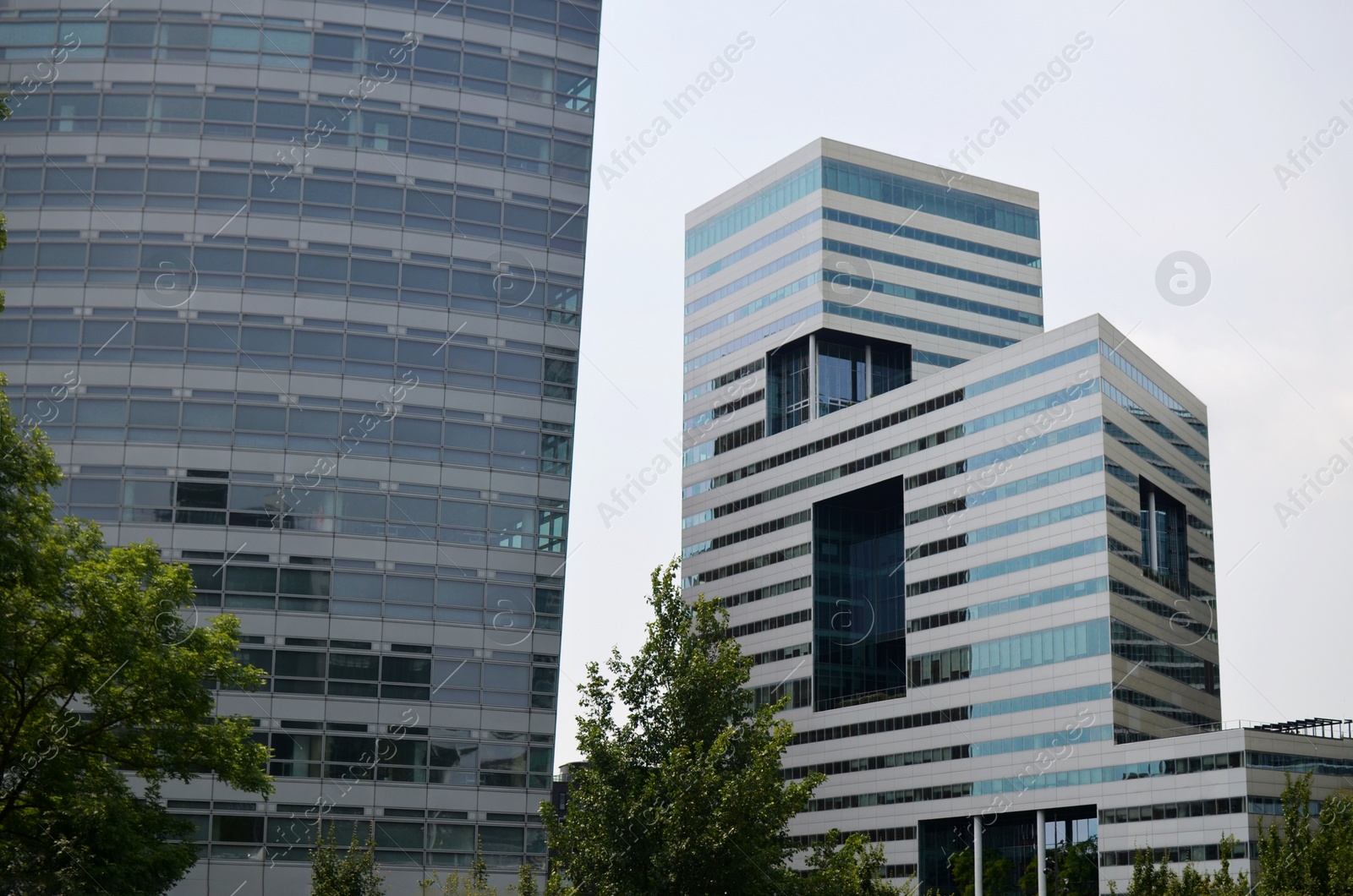 Photo of Exterior of beautiful modern skyscrapers against blue sky