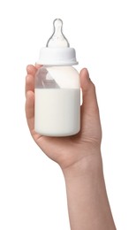 Photo of Woman holding feeding bottle with milk on white background, closeup