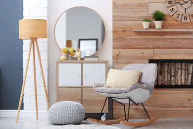 Photo of Elegant round mirror in stylish living room interior