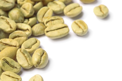 Photo of Green coffee beans and space for text on white background