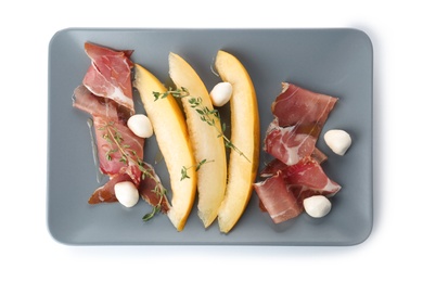 Photo of Plate of melon slices, mozzarella and prosciutto on white background, top view