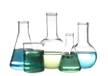 Glassware with liquids isolated on white. Laboratory analysis