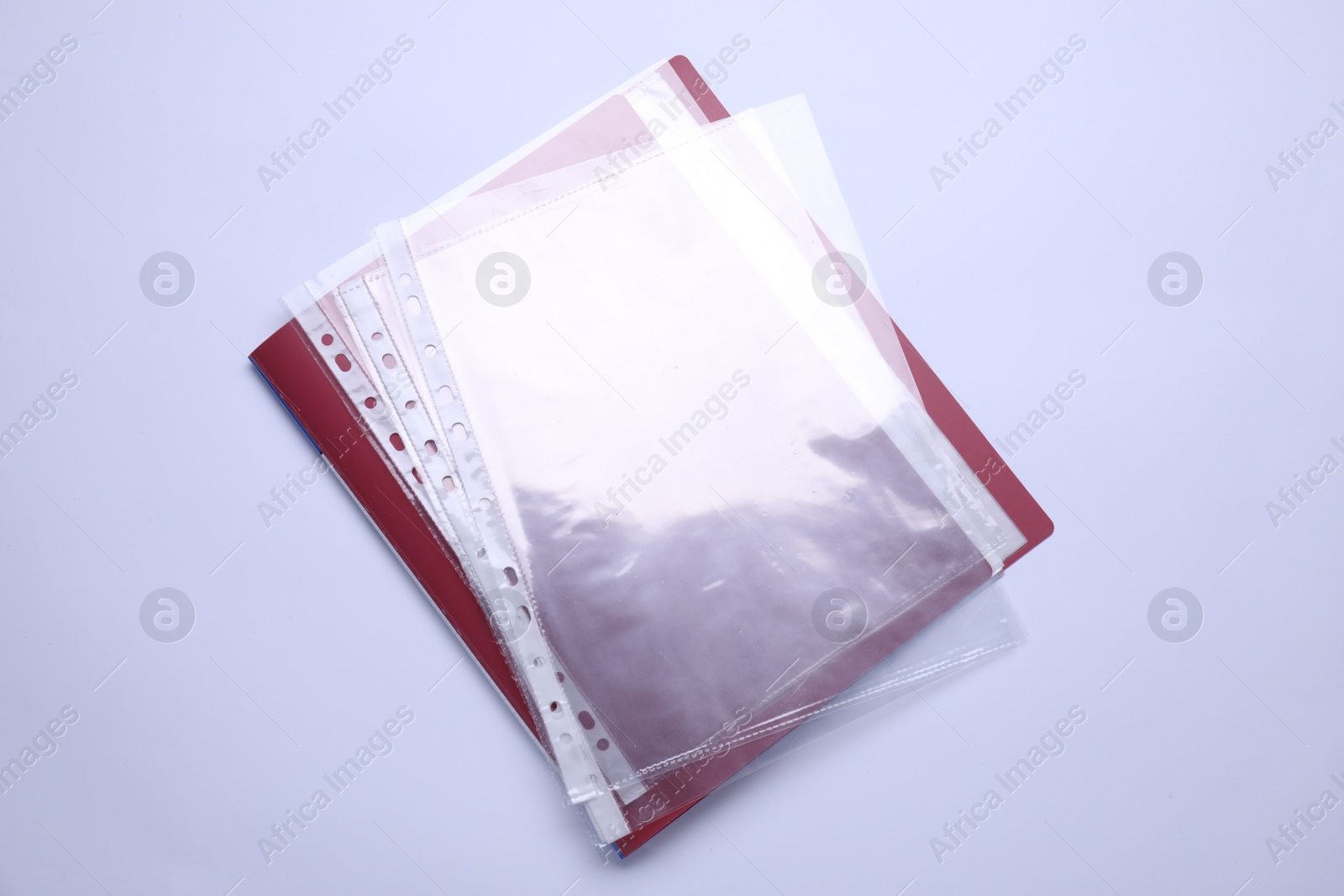 Photo of File folder with punched pockets isolated on white, top view