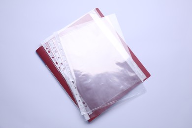 File folder with punched pockets isolated on white, top view