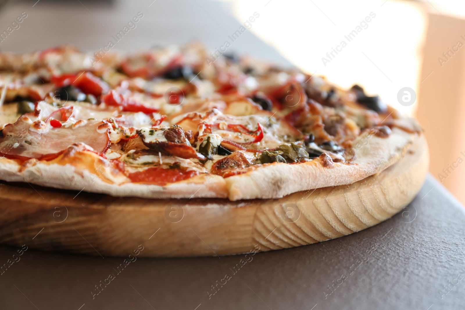 Photo of Delicious fresh pizza on table outdoors, closeup