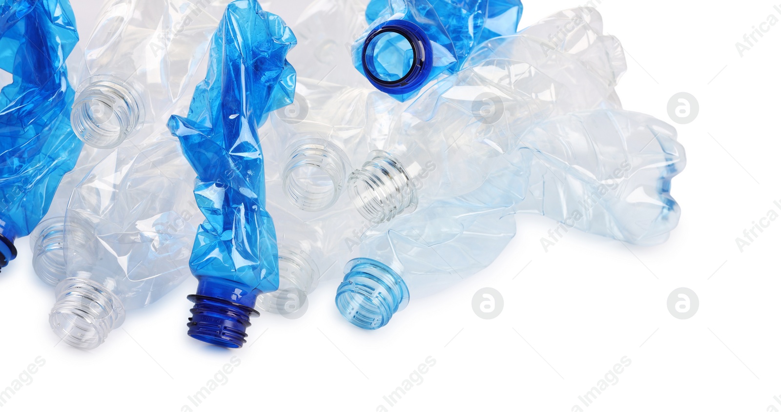 Photo of Crumpled disposable plastic bottles on white background, space for text