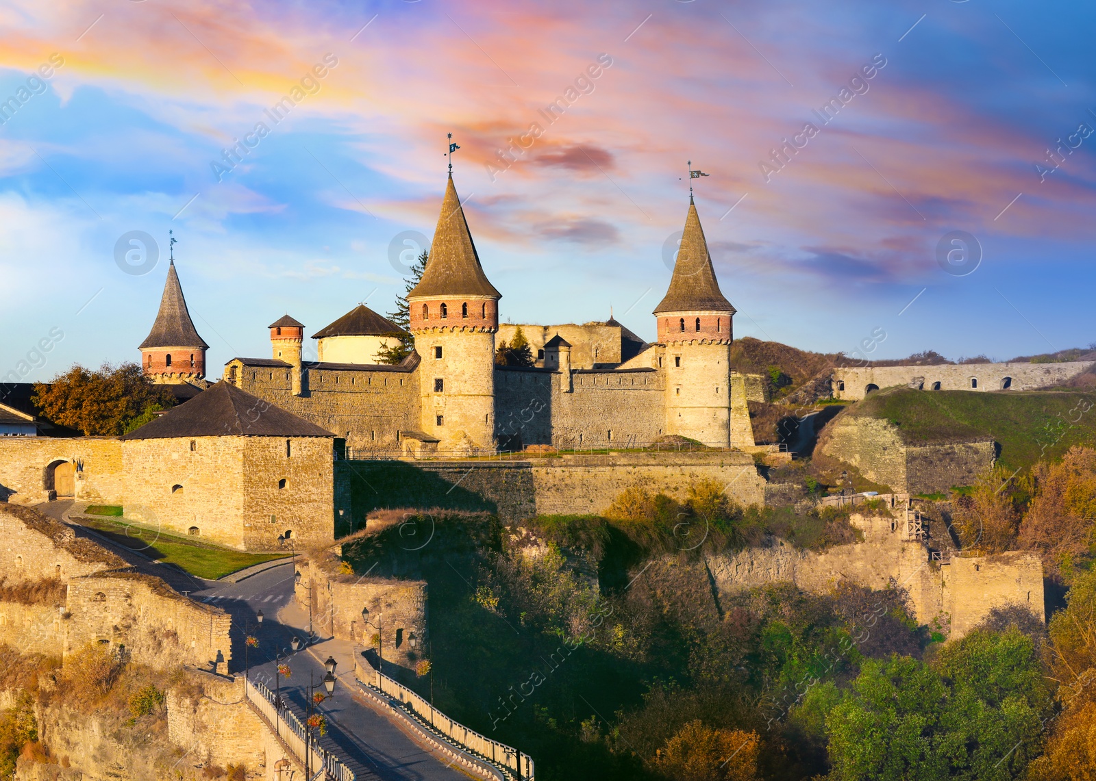 Photo of KAMIANETS-PODILSKYI, UKRAINE - OCTOBER 06, 2018: Beautiful view of Kamianets-Podilskyi Castle on sunny day