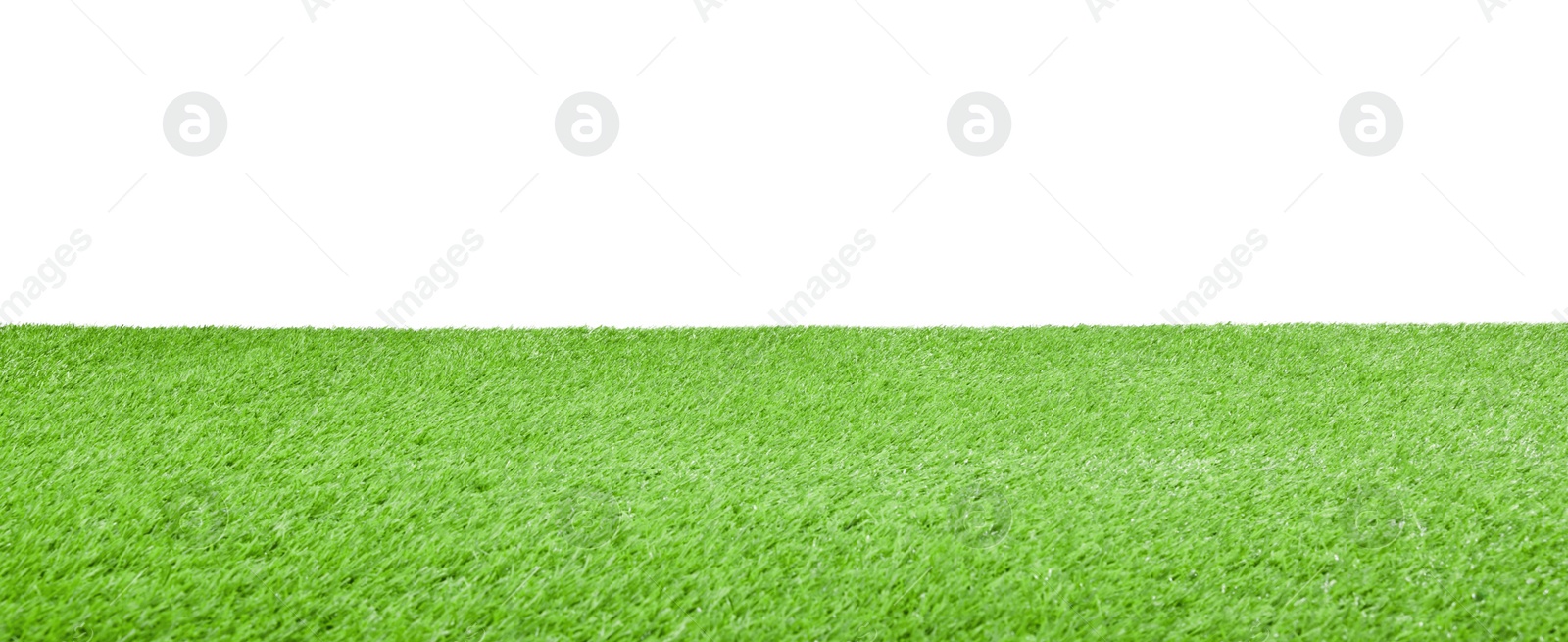 Photo of Green artificial grass surface isolated on white