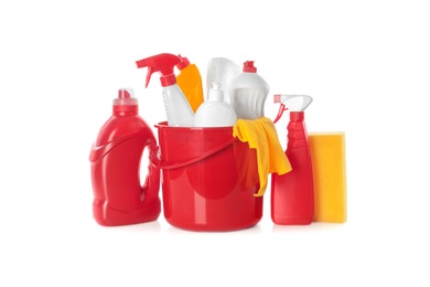 Plastic bucket with different cleaning supplies on white background