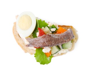 Photo of Delicious bruschetta with anchovies, eggs, tomatoes, bell peppers and cucumbers isolated on white, top view