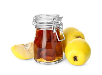 Tasty homemade quince jam in jar and fruits isolated on white