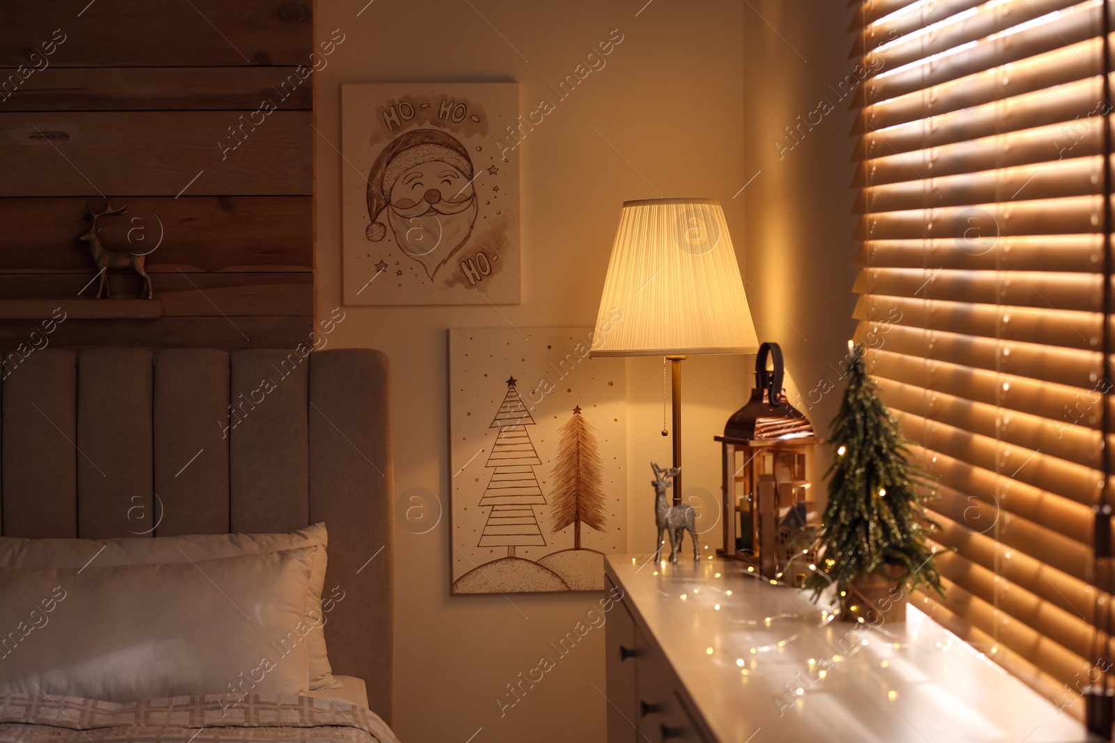 Photo of Beautiful Christmas pictures in decorated room. Interior design