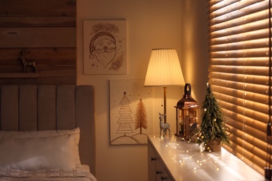 Beautiful Christmas pictures in decorated room. Interior design