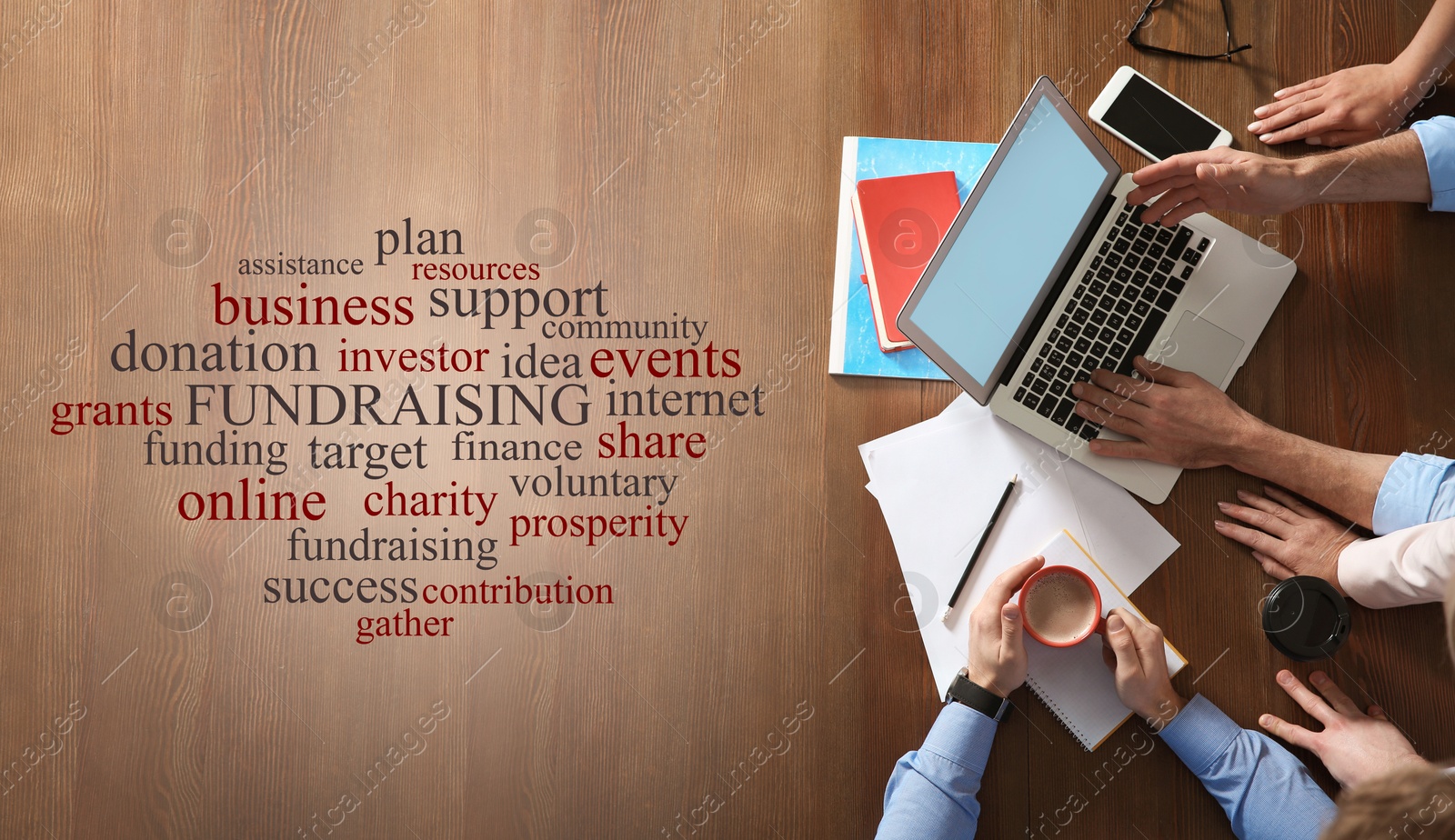 Image of People working together at wooden table, top view. Word cloud with fundraising themed terms