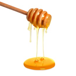 Natural honey dripping from dipper on white background