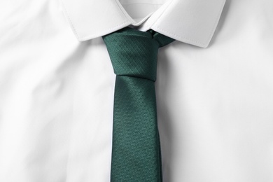 Color male necktie on white shirt, closeup