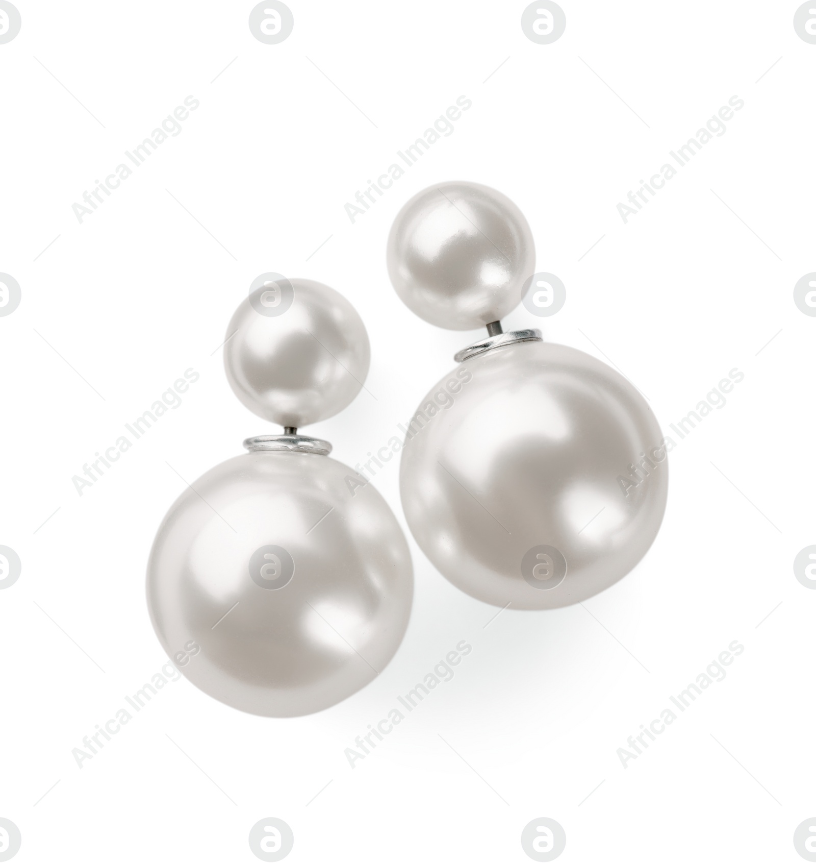 Photo of Elegant pearl earrings isolated on white, top view