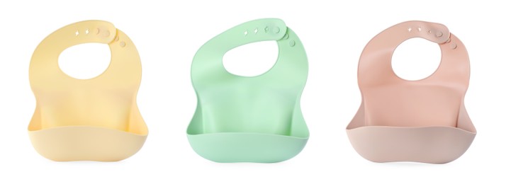 Image of Set with different silicone baby bibs on white background, top view. Banner design