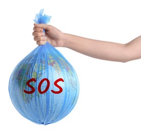 Image of Woman holding globe with word SOS in plastic bag on white background, closeup. Environmental protection concept