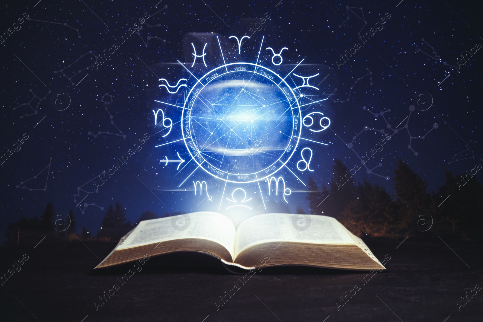 Image of Old book on black surface and illustration of zodiac wheel with astrological signs under starry sky at night
