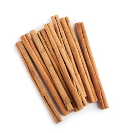 Aromatic dry cinnamon sticks on white background, top view