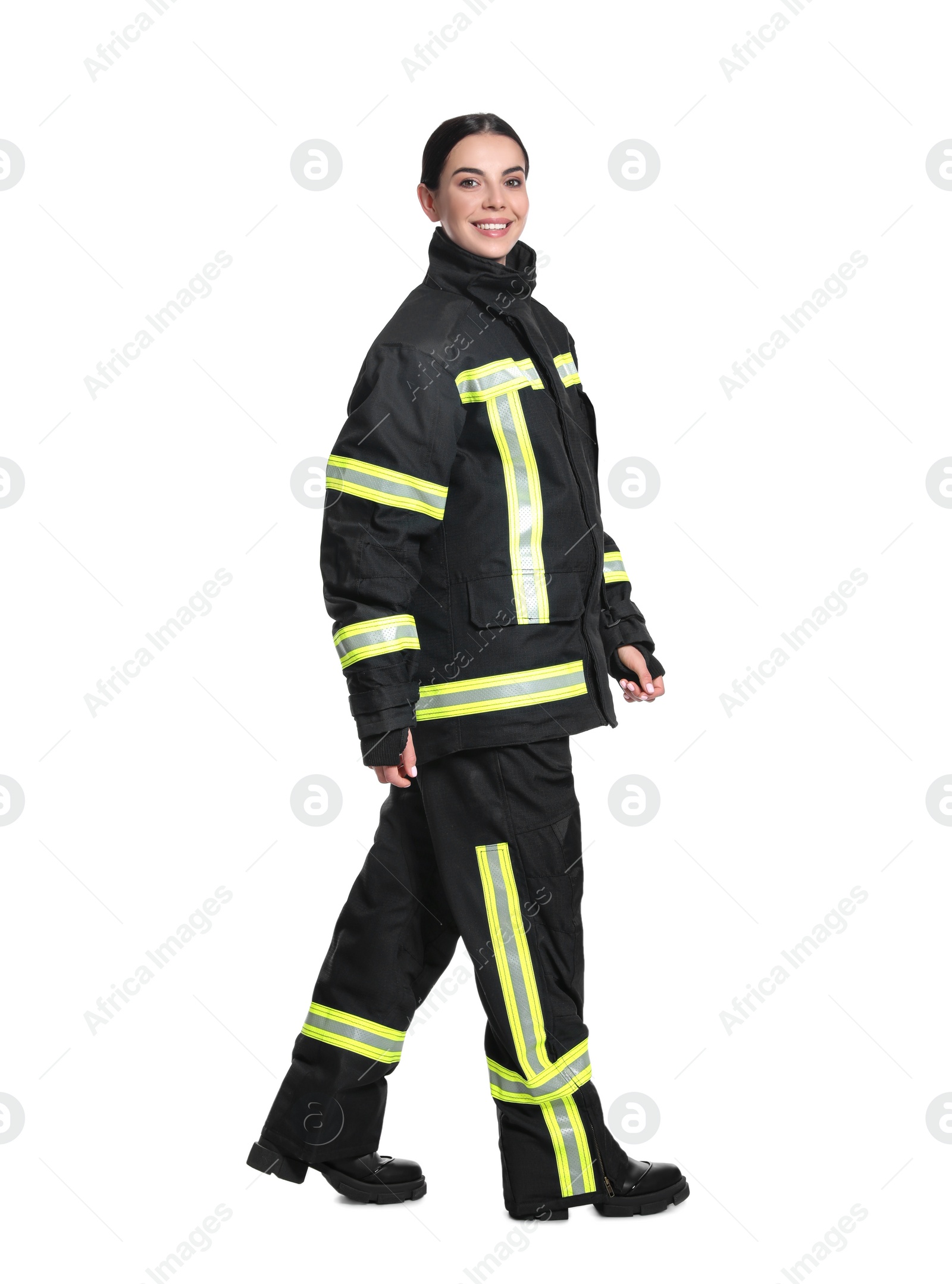 Photo of Full length portrait of firefighter in uniform on white background