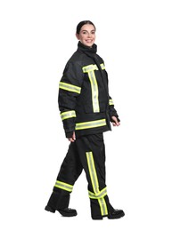 Full length portrait of firefighter in uniform on white background