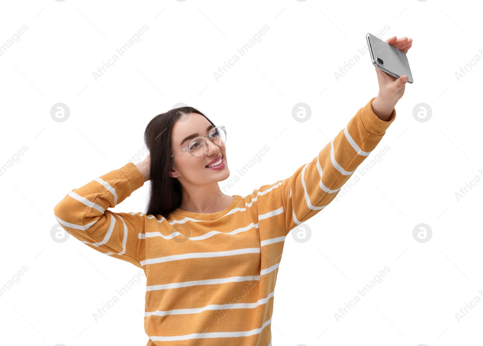 Photo of Smiling young woman taking selfie with smartphone on white background