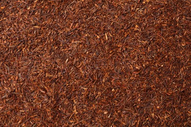 Photo of Dry rooibos tea as background, top view