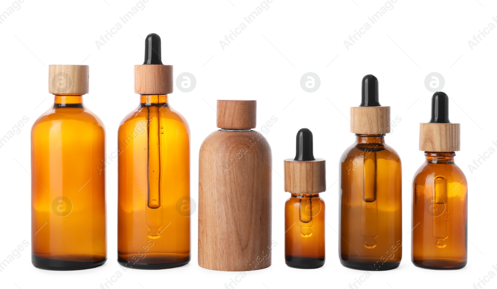 Photo of Row with different bottles of essential oil on white background