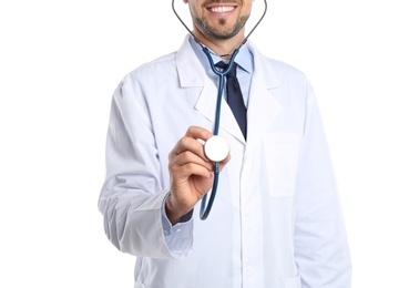 Male doctor holding stethoscope on white background, closeup