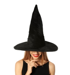 Photo of Beautiful young woman wearing witch costume for Halloween party on white background