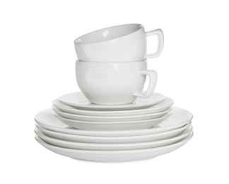 Photo of Stacked plates and cups on white background