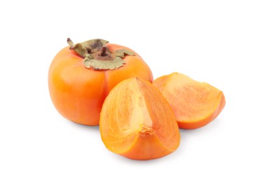 Photo of Whole and cut delicious ripe juicy persimmons on white background