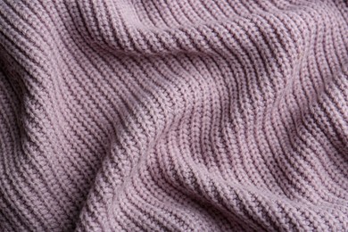 Beautiful violet knitted fabric as background, top view