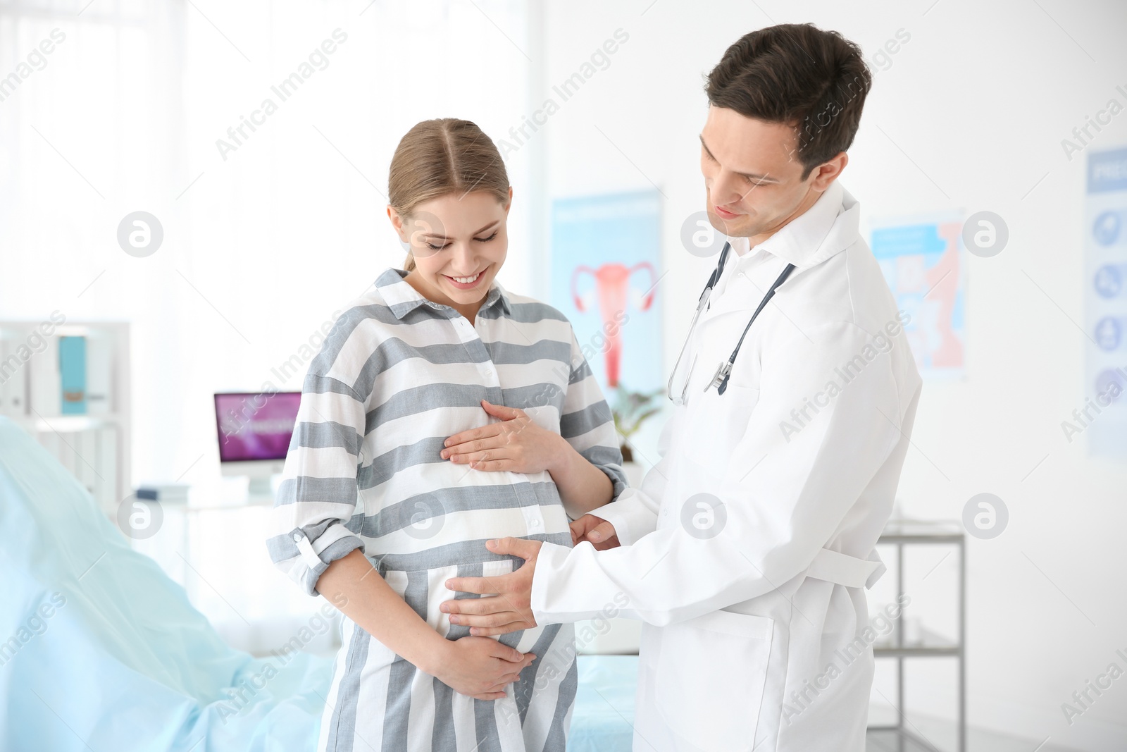 Photo of Gynecology consultation. Pregnant woman with her doctor in clinic