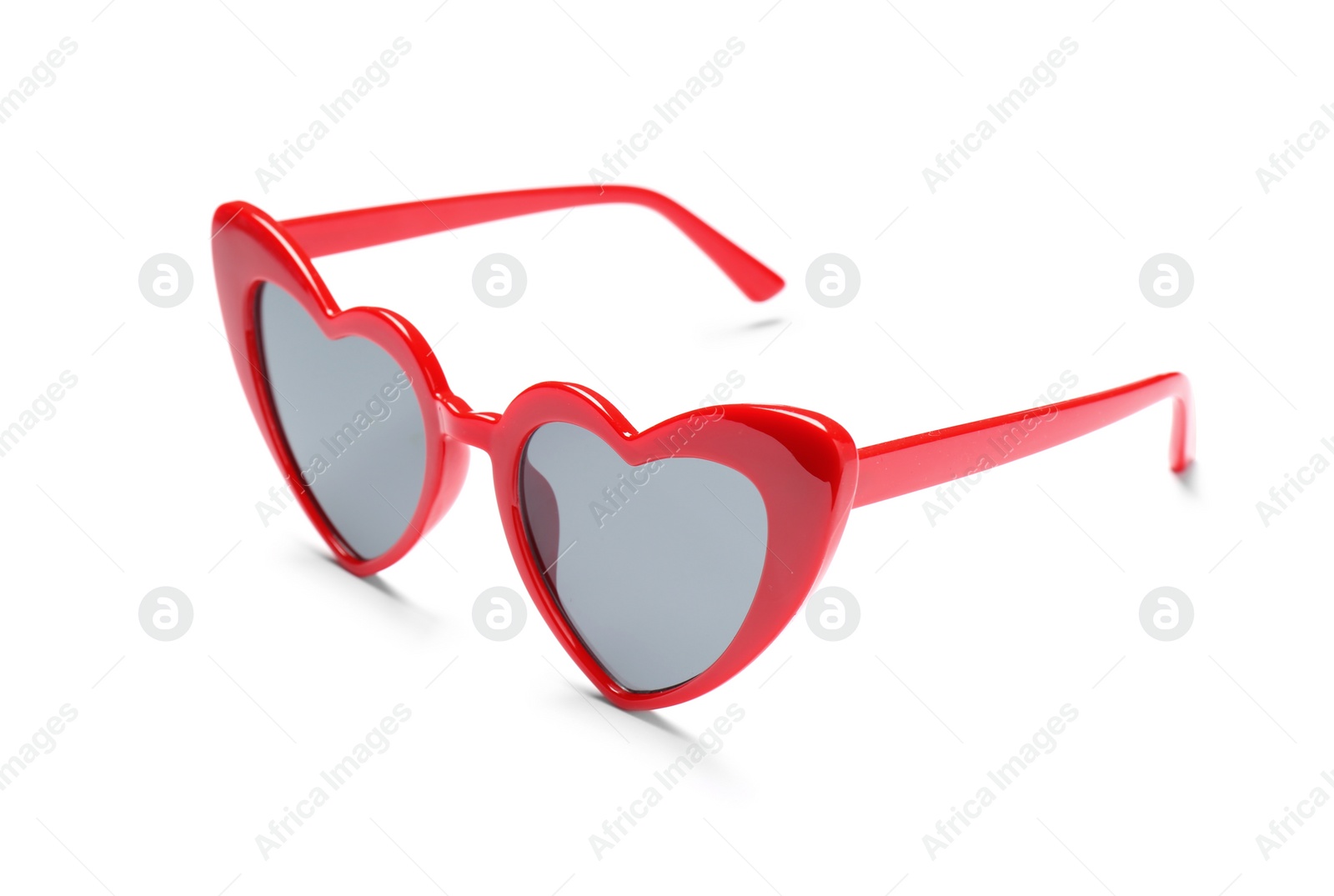 Photo of Stylish heart shaped glasses on white background