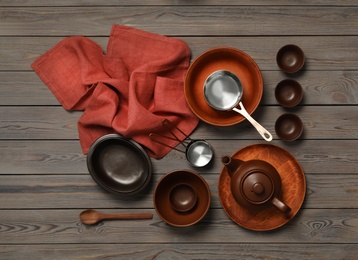 Set of modern cooking utensils on wooden table, flat lay