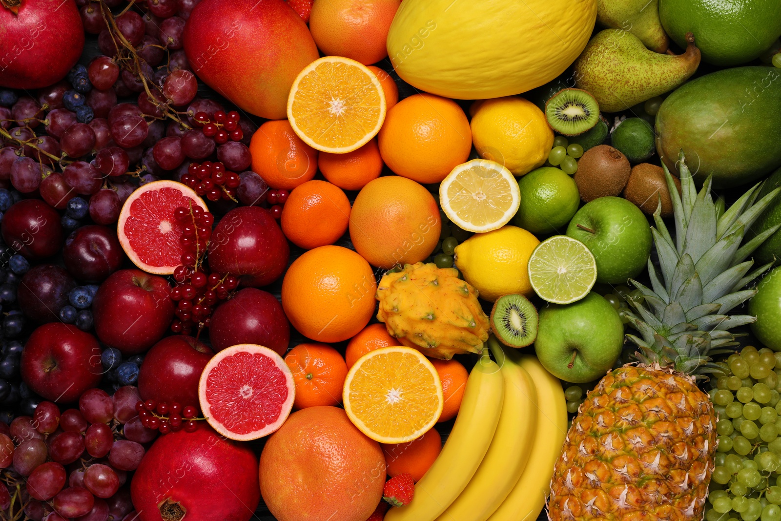 Photo of Different ripe fruits and berries as background, top view