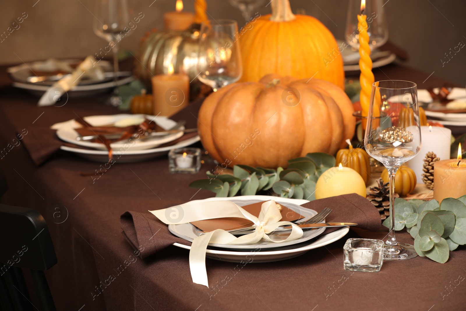 Photo of Beautiful autumn place setting and decor on table in room