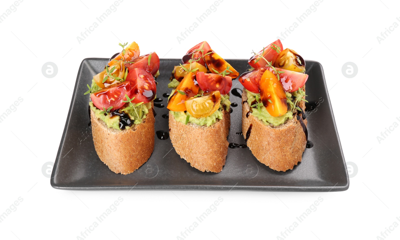 Photo of Delicious bruschettas with avocado, tomatoes and balsamic vinegar isolated on white