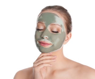 Photo of Beautiful woman with clay mask on her face against white background
