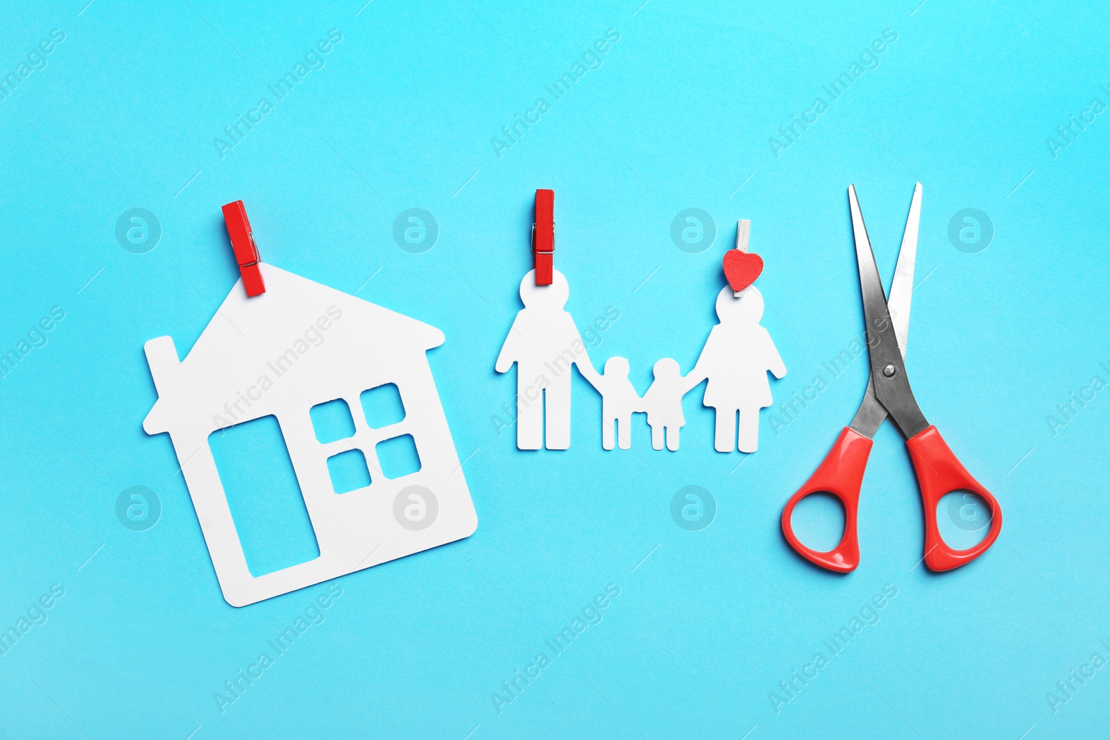 Photo of Paper silhouettes of family with pins, house and scissors on color background, flat lay. Life insurance concept