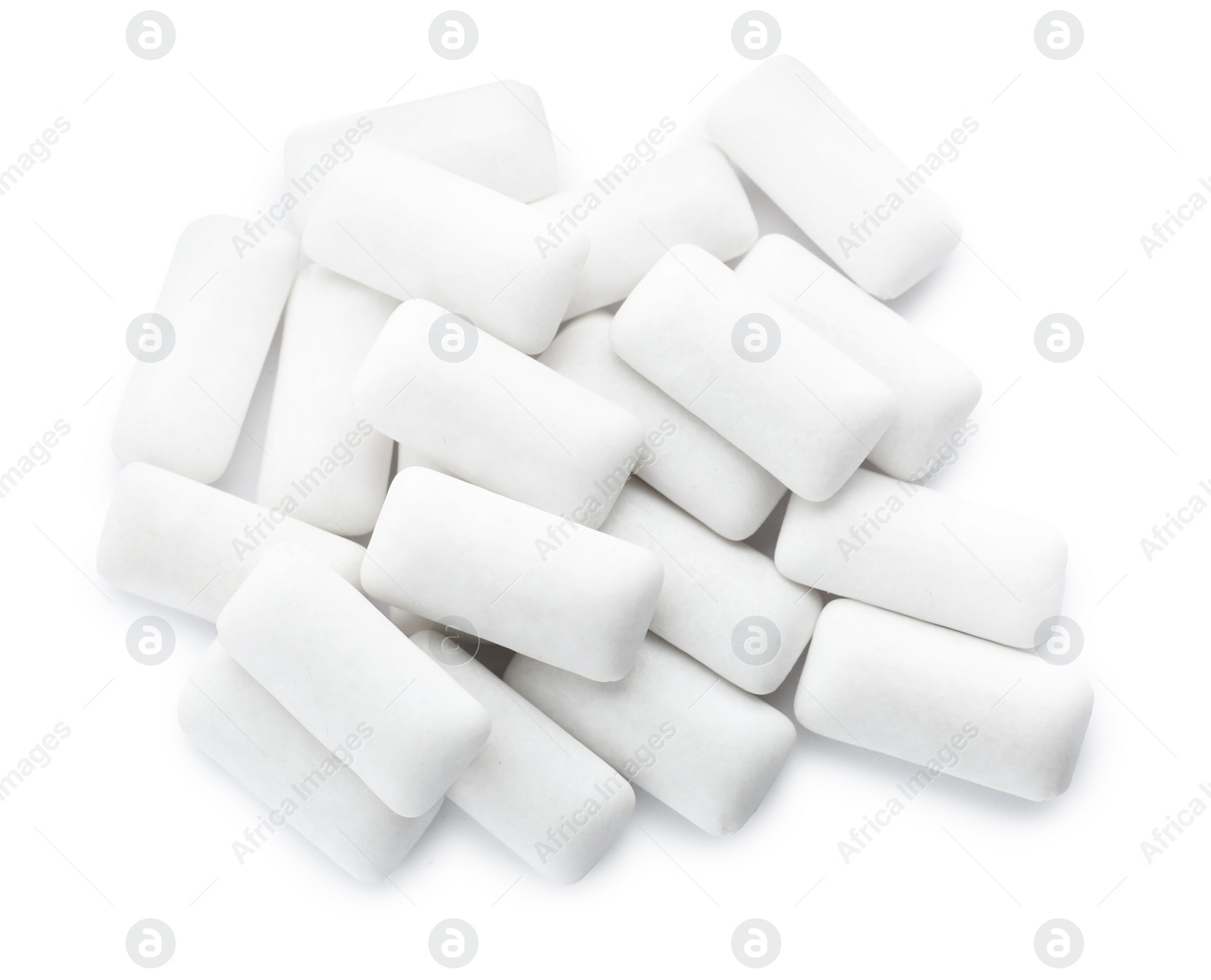 Photo of Heap of chewing gum pieces on white background, top view