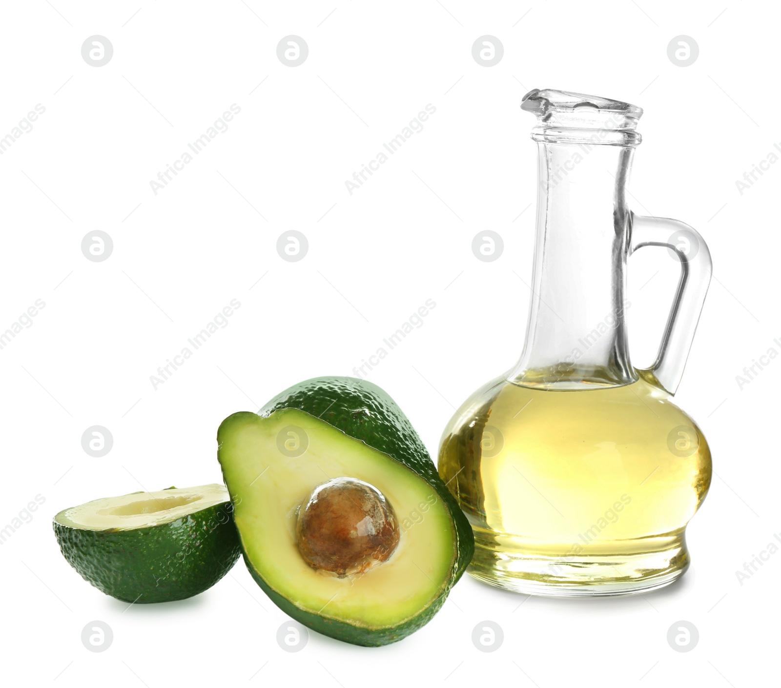 Photo of Pitcher of natural oil and avocados isolated on white