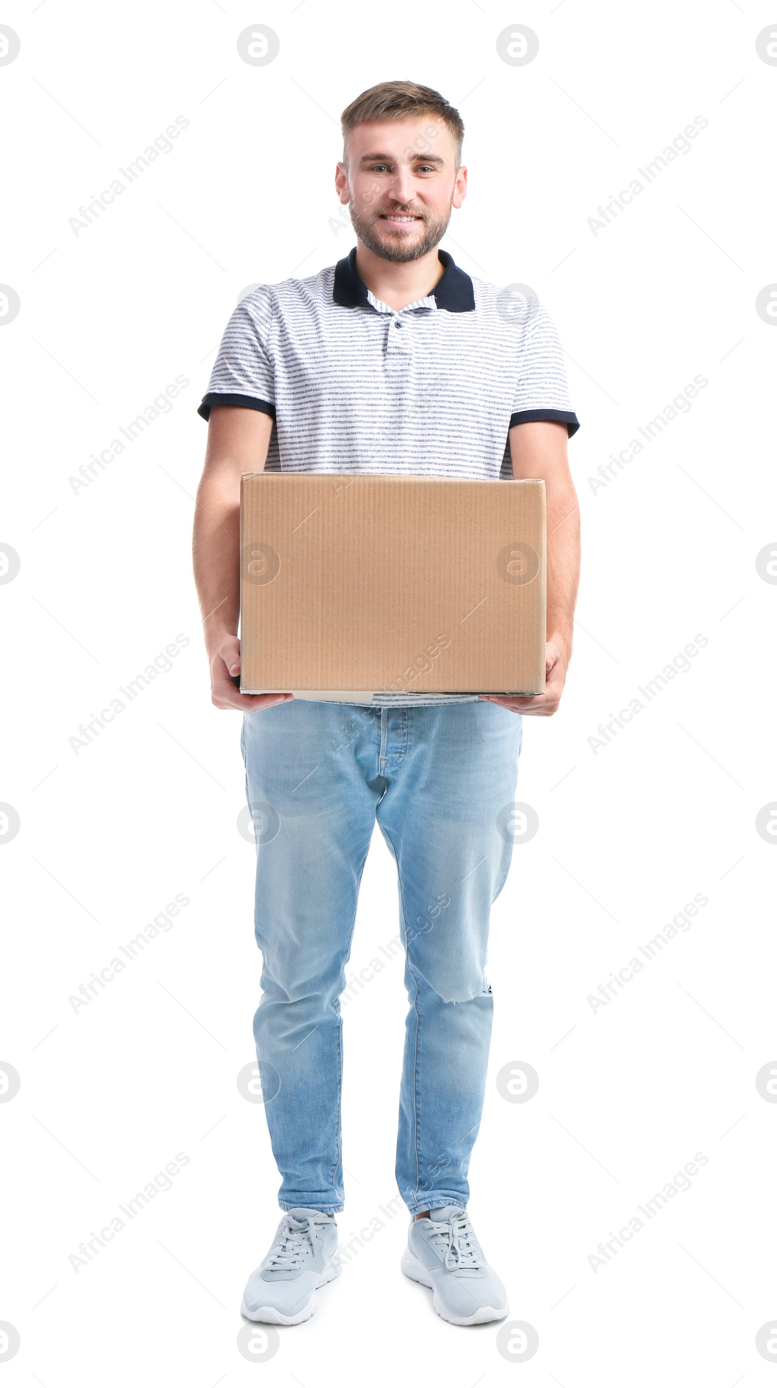 Photo of Full length portrait of young man carrying carton box on white background. Posture concept