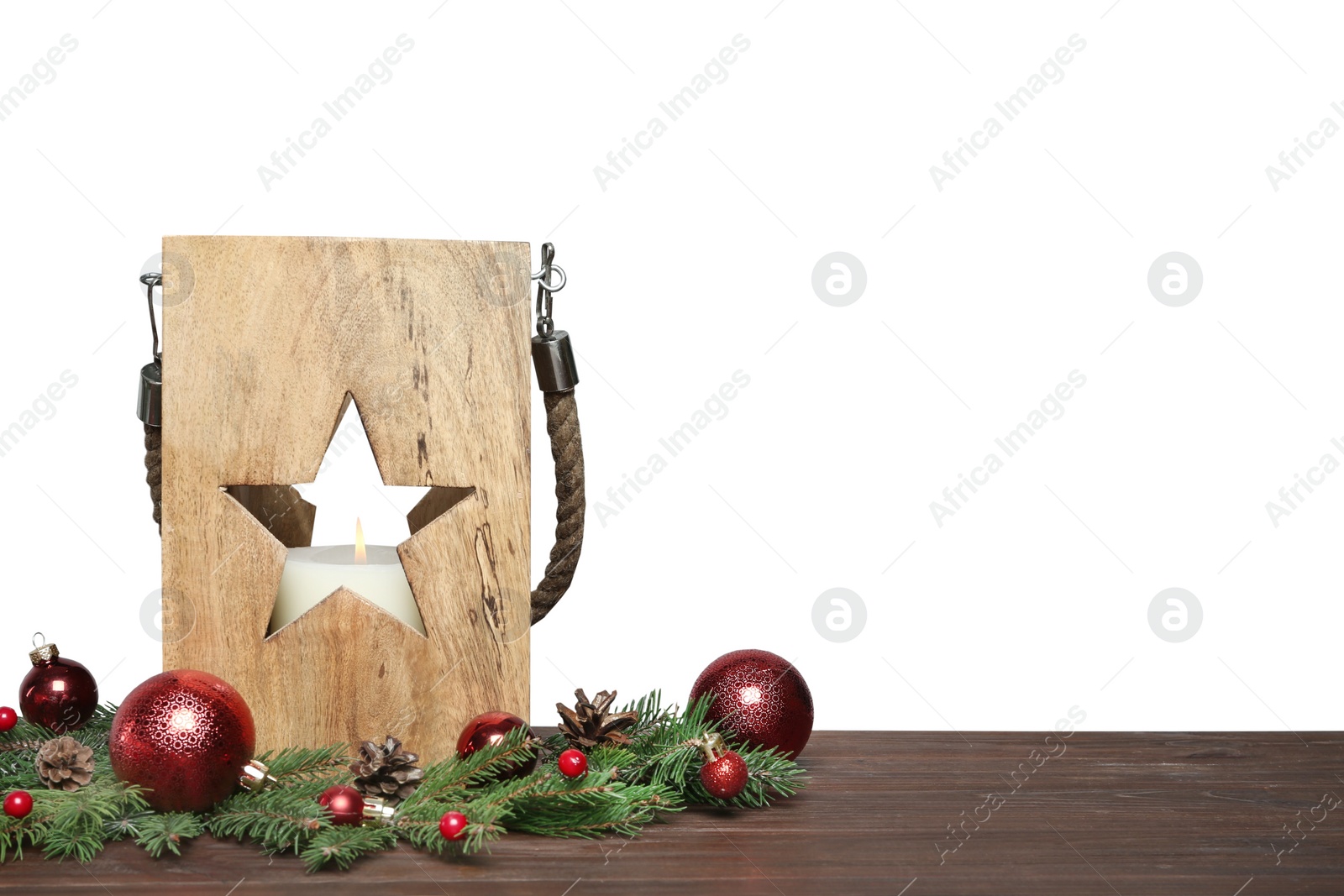 Photo of Wooden Christmas lantern with burning candle and decor on table, space for text