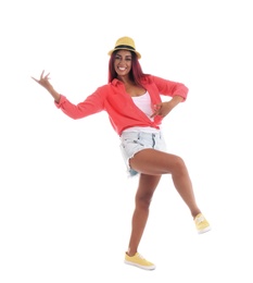 Beautiful Hispanic woman dancing on white background