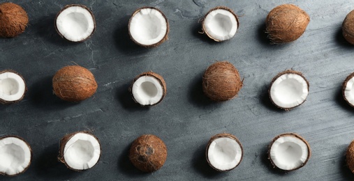 Photo of Coconut pattern on grey table, flat lay