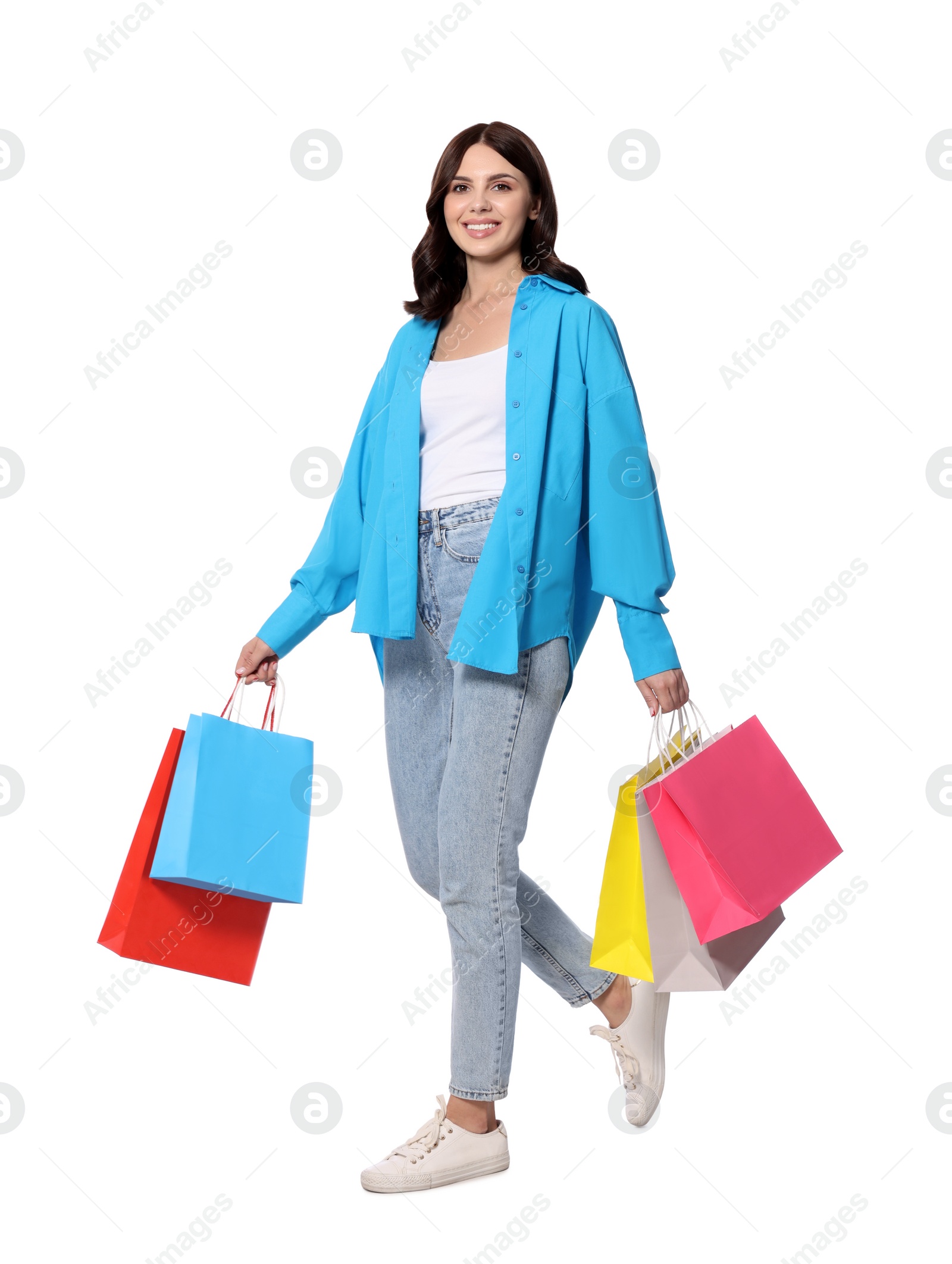 Photo of Beautiful young woman with paper shopping bags on white background